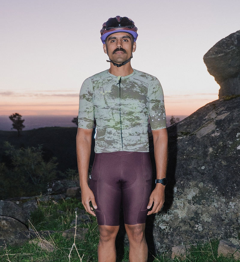 ON_OFF GRID SuperSYSTEM men's cycling jersey (Erosion print) front view, lightweight breathable moisture-wicking high-stretch fabric, aerodynamic fit with front zip, bonded hem, hydration tube channel and reflective accents for gravel/road riding