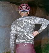 Men's ON_OFF GRID SuperSYSTEM long-sleeve basalt cycling jersey back view — ultralight high-stretch breathable performance gravel jersey with hydration tube channel, bonded hem, ergonomic sleeves, smart pockets and reflective accents