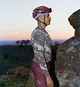 Men's ON_OFF GRID SuperSYSTEM long-sleeve basalt cycling jersey side view — ultralight, high-stretch woven gravel/road performance jersey with moisture-wicking fabric, bonded hem, hydration tube channel, smart storage, reflective accents