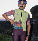 Neon lime ON_OFF GRID SafetySHELL unisex cycling gilet close-up - packable windproof, water-resistant ripstop vest with breathable mesh panels, high collar, reflective glow safety details and two-way waterproof zipper
