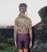 ON_OFF GRID SuperSYSTEM women's long-sleeve cycling jersey, back view, multi-rock camo, ultralight high-stretch breathable moisture-wicking gravel/endurance jersey with bonded hem, reflective accents, hydration tube channel and ergonomic sleeves