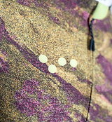 ON_OFF GRID SuperSYSTEM women's long-sleeve cycling jersey close-up, multicolor rock print, micro-perforation ventilation dots, zipper pull, moisture-wicking breathable ultralight performance jersey for road and gravel riding
