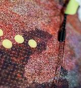 ON_OFF GRID SuperSYSTEM women's cycling jersey, red speckled ultralight high-stretch woven fabric with yellow ventilation dots, breathable moisture-wicking for gravel and road, bonded hem, ergonomic sleeve, hydration tube channel, reflective accents