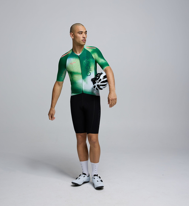 Pedla PRO Men's Pursuit 2.0 Jersey AirFoils Green - Meet your short sleeve cycling jersey for when rapid is the name of the game. High end Italian fabrics combine with an engineered fit to result in a jersey ready for your next pursuit. The AeroPRISMA sleeves are finished at the hems with a heat-welded seal, negating the need for any stitching.