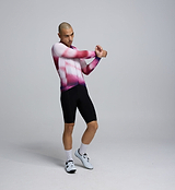 Side profile of the Men's Pursuit LS 2.0 Jersey – AirFoils Hot Pink, highlighting mesh underarm ventilation panels, bonded sleeve hems, and contoured fit for speed-focused riding.