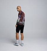 Side profile of the Men's Pursuit 2.0 Long Sleeve Cycling Jersey in AirFoils Plum, showing mesh underarm panels for ventilation and heat-welded sleeve hems for aerodynamic efficiency.