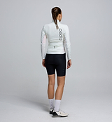 Back view of the Porcelain Deflect 2.0 Jacket, showcasing storm-flap-covered rear pockets, a dropped hem for coverage, and reflective accents for low-light visibility.