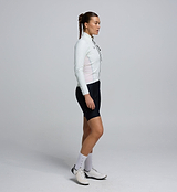 Side profile of the Women's Deflect 2.0 Cycling Jacket in Porcelain, highlighting the flexible 4-way stretch side panels and underarm zones for enhanced freedom of movement.