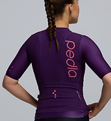 Macro image showing the advanced woven fabric texture and inner silicone sleeve grippers of the Pursuit AIR Jersey in Plum, optimized for airflow, comfort, and aerodynamic fit.