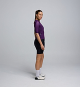Side profile of the Women's Pursuit AIR Jersey – Plum, highlighting its breathable mesh structure, UPF 35+ protection, and silicone-injected aero sleeves that stay in place during movement.