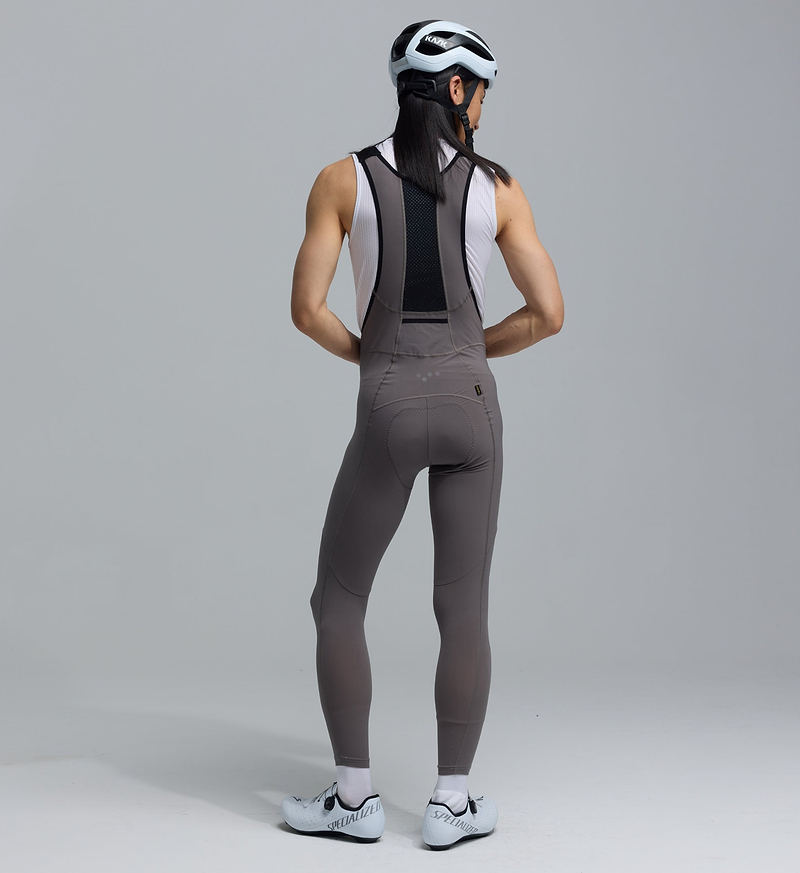 PRO SuperFit Air men's battleship grey cycling bib tights (back view) — ultra-lightweight Italian 4-way stretch compression fabric, flatlock seams, breathable perforated back panel, Elastic Interface 8+ hour road chamois, UPF 50+, iridescent reflective logos and small stash pocket — performance road cycling for endurance, racing and training