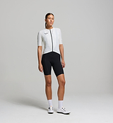 Cyclist wearing the Women’s Pursuit AIR Cycling Jersey in Porcelain, showcasing its aerodynamic fit, moisture-wicking fabric, and UPF 35+ sun protection for summer cycling.