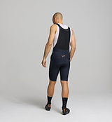 Back view of men’s SuperSYSTEM bib shorts – hydration pocket and hose channel built for long-distance performance and adventure riding