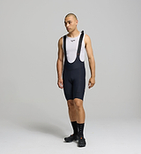 Side profile of black men’s cycling bib shorts – breathable Superfit fabric with stash pockets for on-bike essentials