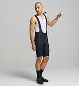 Front view of male cyclist wearing black SuperSYSTEM bib shorts – streamlined fit with high-density EIT chamois for all-day comfort