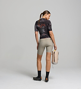 Back view of dark purple women’s SuperSYSTEM jersey – rear storage pockets and reflective accents for visibility and on-bike function