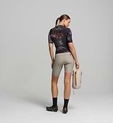 Back view of dark purple women’s SuperSYSTEM jersey – rear storage pockets and reflective accents for visibility and on-bike function