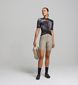 Front view of female cyclist wearing dark purple SuperSYSTEM jersey – breathable woven fabric with bonded hem and aero fit