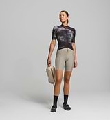 Front view of female cyclist wearing dark purple SuperSYSTEM jersey – breathable woven fabric with bonded hem and aero fit