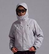 Pedla x N-0 grey 3-layer waterproof shell jacket close-up — laminated stretch nylon, fully taped seams, adjustable hood with brim, YKK waterproof zipper, large pockets, adjustable cuffs and hem, unisex bike commuter rain jacket