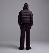 PEDLA x N-0 black hooded down pullover (rear view), lightweight channel-quilted DWR nylon puffer jacket with insulated hood, drawcord hem and zipped pockets — unisex technical cycling streetwear