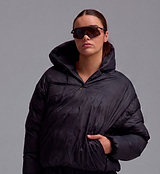 PEDLA x N-0 black lightweight down pullover jacket, channel-quilted nylon shell with DWR, insulated hood and collar zip, drawcord hem, elastic cuffs and zipped hand pockets — unisex cycling-to-street outerwear close-up on model