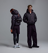 PEDLA x N-0 black lightweight hooded down pullover jacket, unisex technical cycling and streetwear, channel-quilted DWR nylon shell, insulated down, zip hand pockets, elastic cuffs, drawcord hem, front view