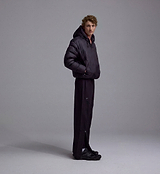 PEDLA x N-0 black lightweight insulated down pullover side profile, unisex channel-quilted hooded jacket with DWR nylon shell, collar zip, zippered hand pockets, elastic cuffs and drawcord hem.