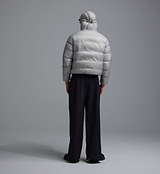PEDLA x N-0 grey lightweight insulated down pullover back view, hooded channel-quilted nylon shell with DWR finish, zip collar, drawcord hem and zipped hand pockets — unisex technical cycling streetwear jacket