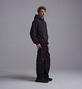 PEDLA x N-0 heavyweight black cotton fleece cropped hoodie, garment-washed unisex streetwear pullover with two-piece hood and kangaroo pocket, back view on model