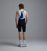 Men's black race training cycling bib shorts (back view) with bonded Grid Mesh brace, premium Italian compressive fabric, 4+ hr multi-density chamois, laser-cut silicone cuffs, reflective logos, Race Fit 24cm inseam