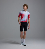Men's Race Division red grid training cycling jersey front view — performance short-sleeve, UPF 30+, REPREVE recycled polyester blend, breathable perforated panels, silicone gripper hem, four-way stretch