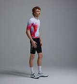 Race Division men's training cycling jersey, white grid with red side gradient, REPREVE recycled polyester, UPF 30+, breathable perforated panels, moisture-wicking four-way stretch, silicone gripper hem