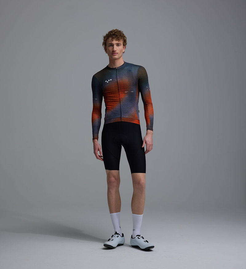 Men's long-sleeve training cycling jersey, blue-orange grid print, breathable perforated panels, UPF30+ sun protection, REPREVE recycled polyester, moisture-wicking, four-way stretch, silicone gripper hem, extended sleeves