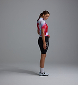 Women's Race Division Classic LITE gilet red grid side view, lightweight packable cycling vest, windproof water-resistant front, breathable mesh back, reflective details, SAB two-way zipper, three reinforced rear pockets, recycled fabric