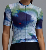 Close-up of Race Division women's cobalt grid training cycling jersey, short-sleeve full-zip performance jersey in REPREVE recycled polyester, UPF 30+, moisture-wicking breathable fabric, four-way stretch, silicone gripper hem