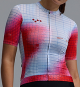 Race Division women's training cycling jersey close-up, red/white grid print, short-sleeve breathable perforated fabric, front zip, silicone gripper hem, UPF 30+, REPREVE recycled polyester, moisture-wicking four-way stretch