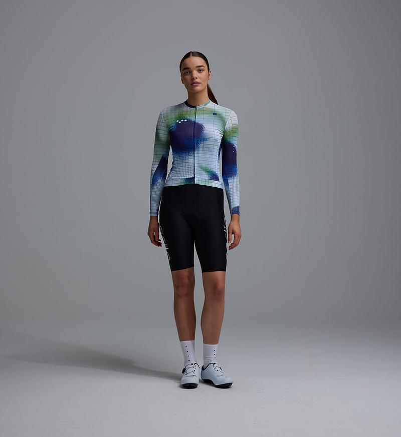 Women's Race Division training long-sleeve cycling jersey, cobalt grid print, zip front, UPF 30+, REPREVE recycled polyester blend, breathable perforated panels, silicone gripper hem, extended sleeves