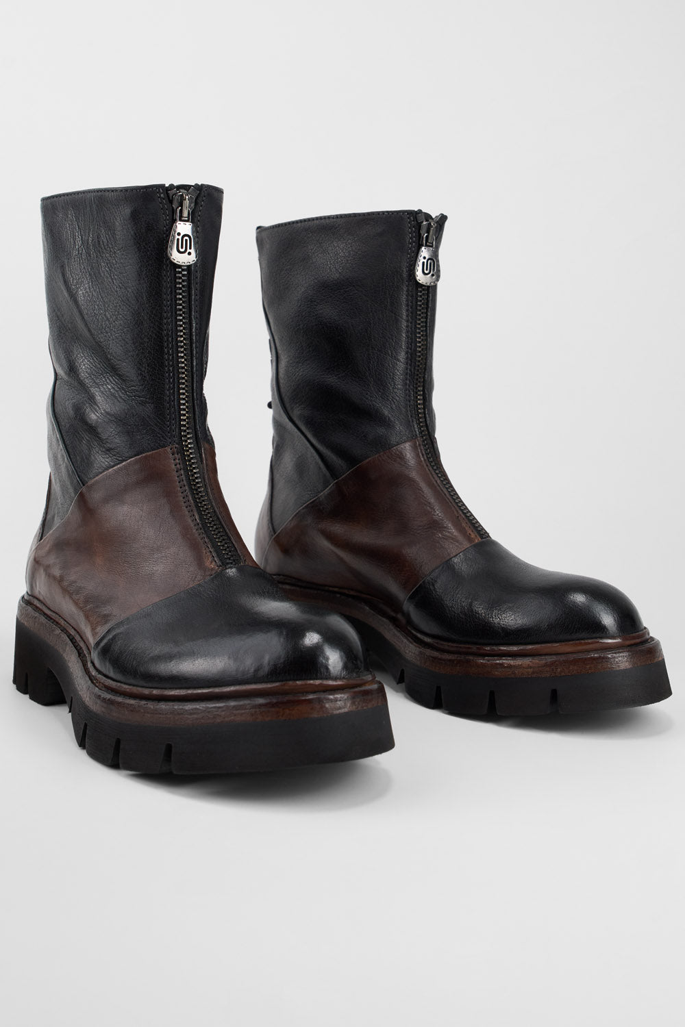 BLAKE tan & black welted front-zip boots.