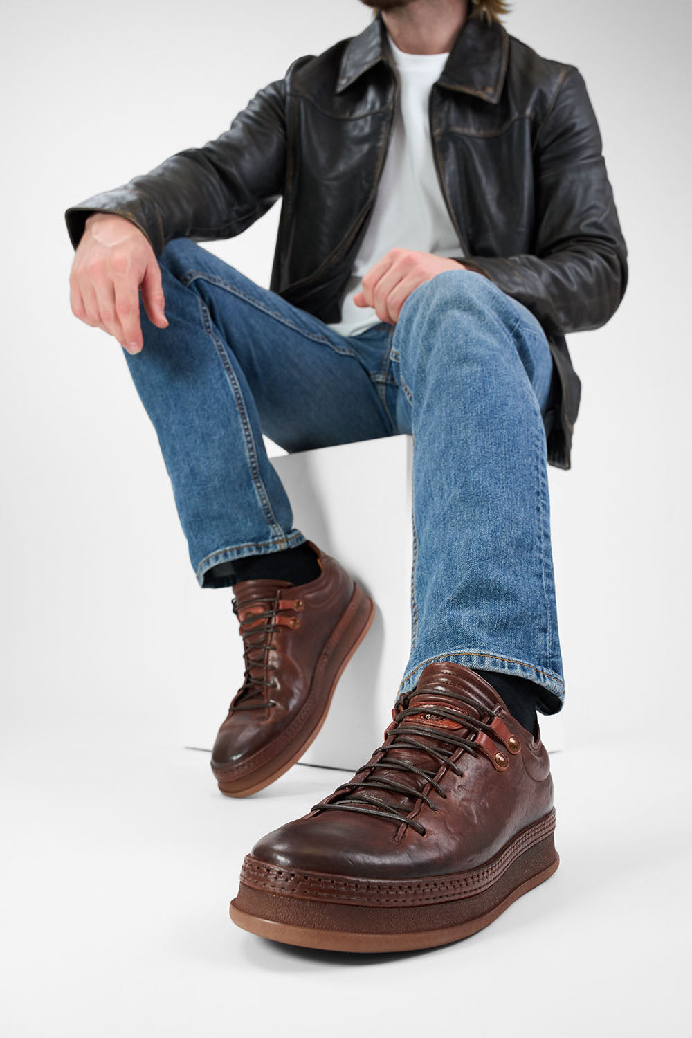 COLE cognac welted distressed loop sneakers.