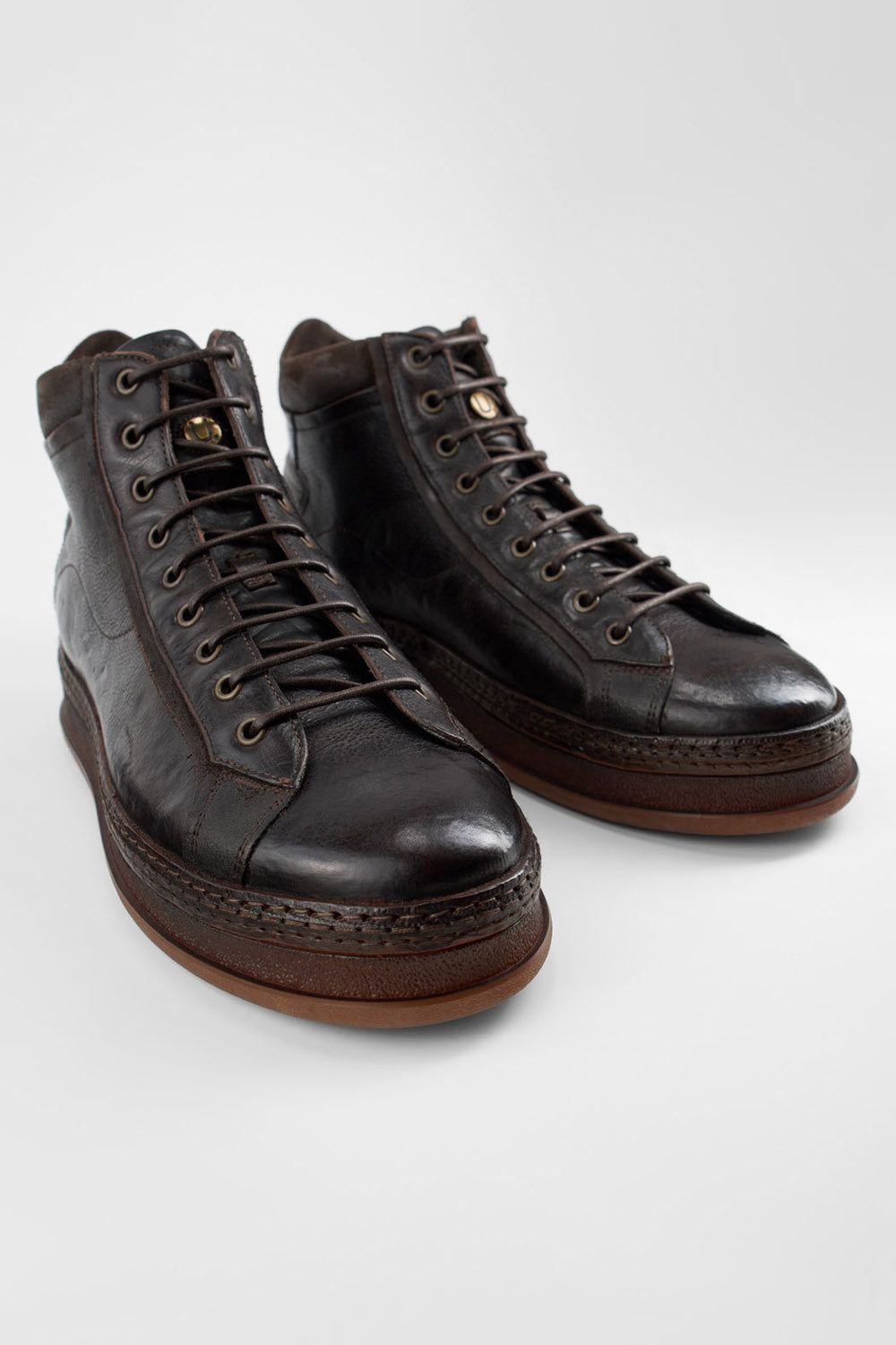 COLE dark-cocoa welted distressed high sneakers.