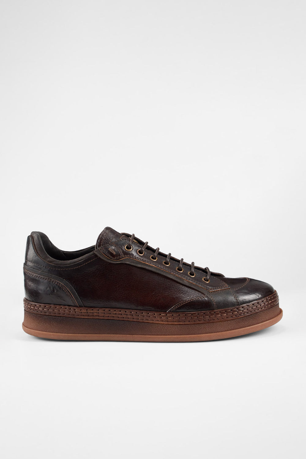COLE dark-cocoa welted distressed sneakers.