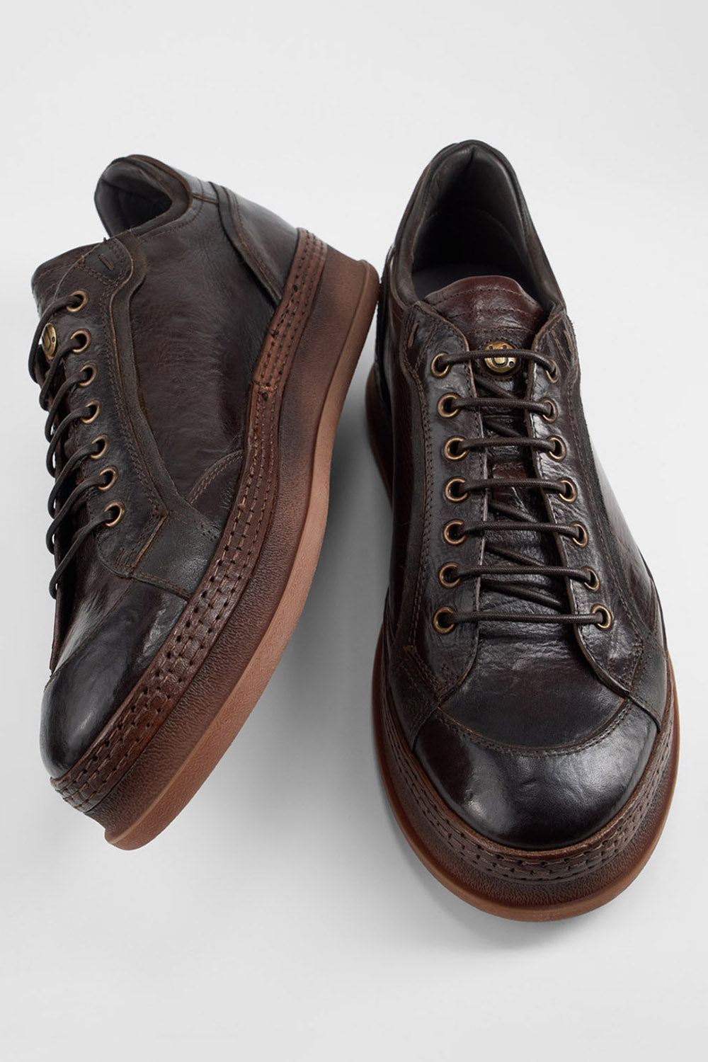 COLE dark-cocoa welted distressed sneakers.