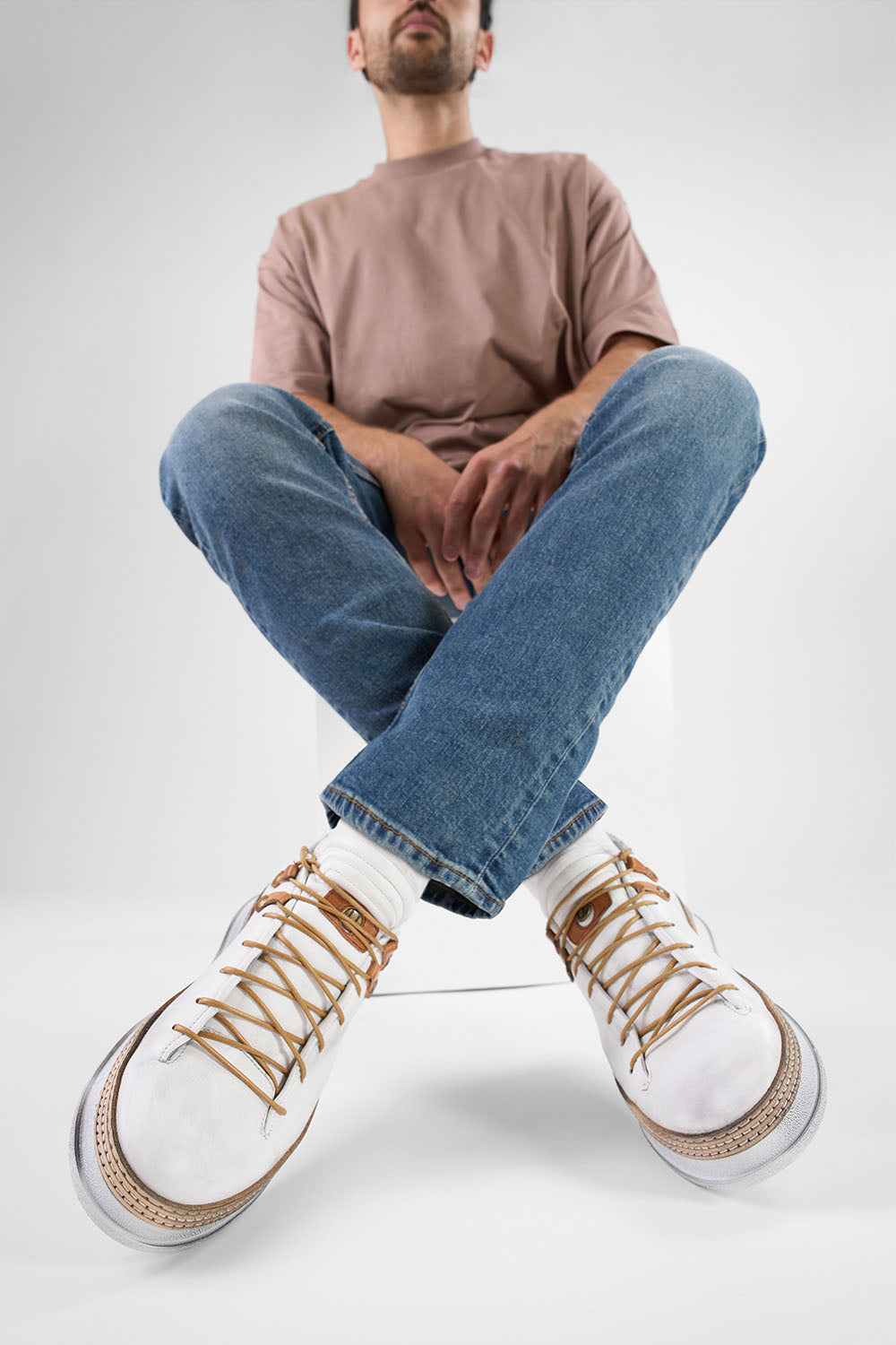 COLE white welted distressed loop sneakers.