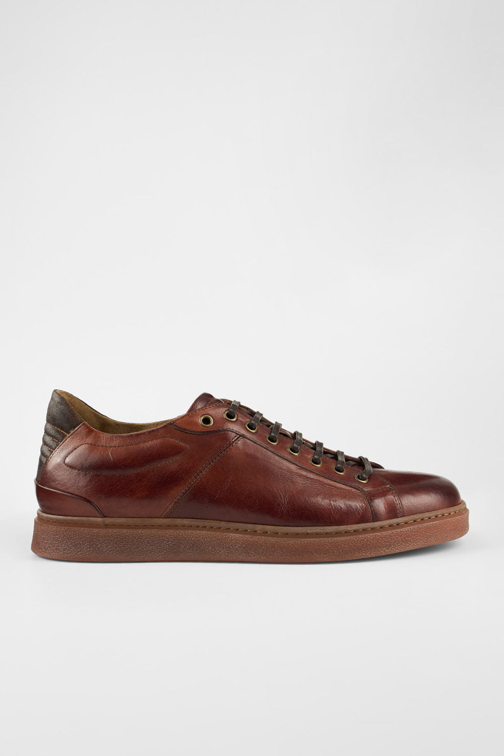 CREED cognac distressed sneakers.