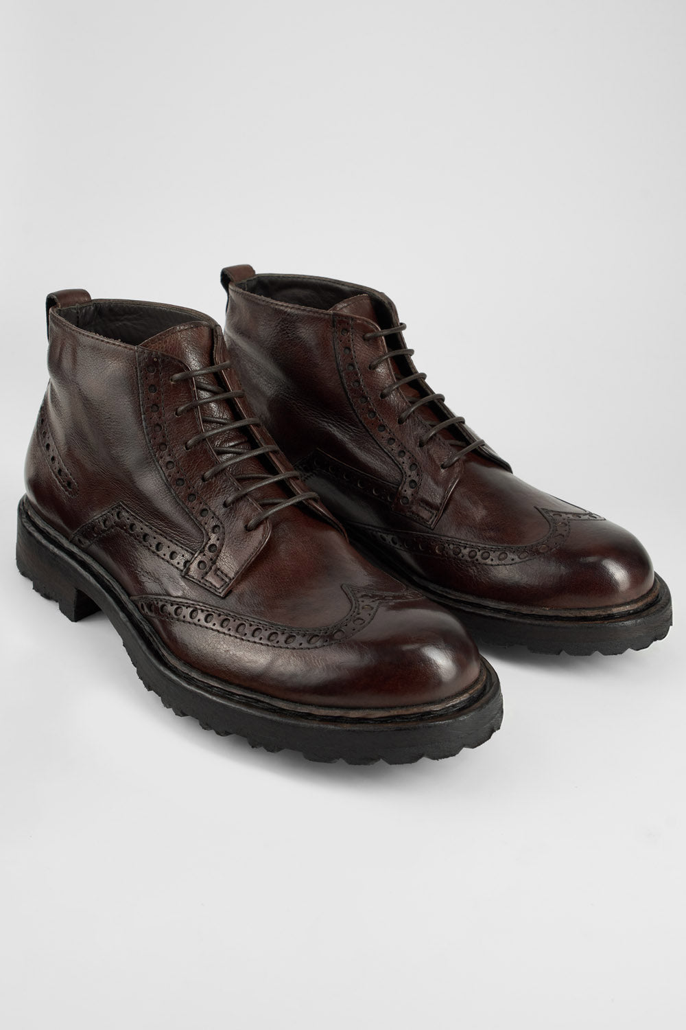 DRAKE dark-chestnut brogue chukka boots.