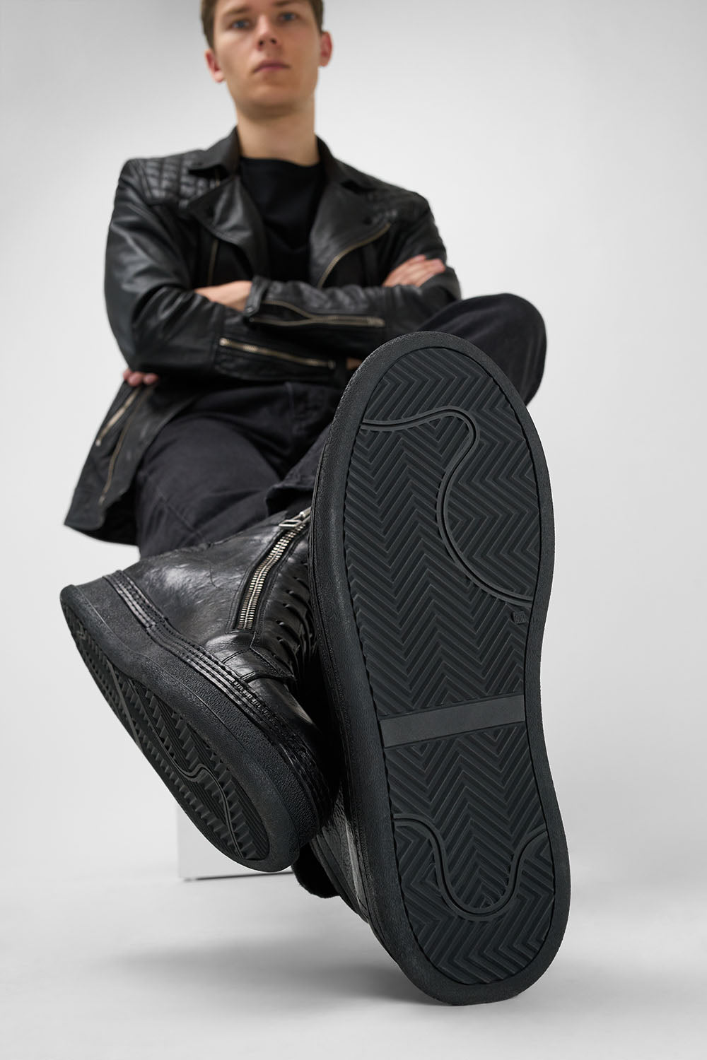 COLE rugged-black welted double-zip high sneakers.