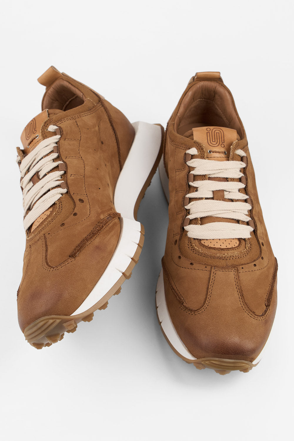 PEARCE rust-brown nubuck wingtip runners.