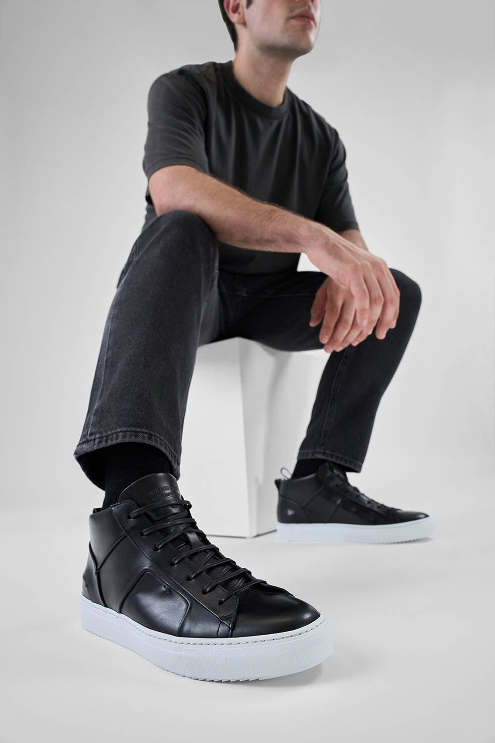 SKYE tuxedo-black folded mid sneakers.