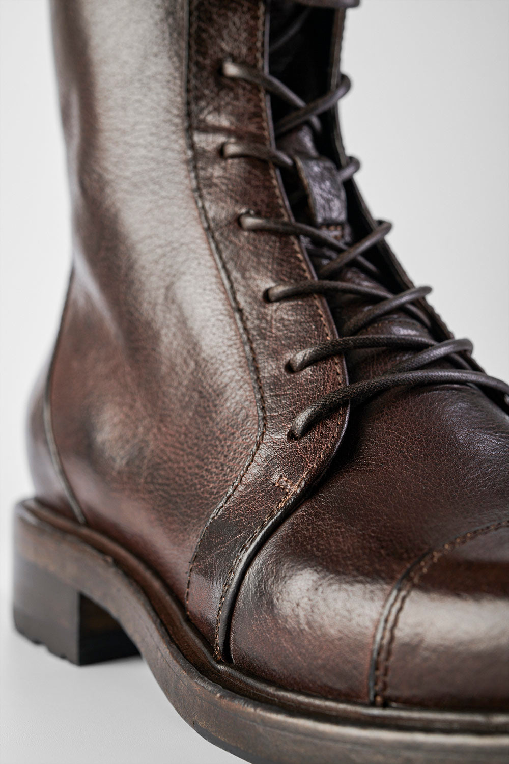 AVERY dark-plum lace up boots.